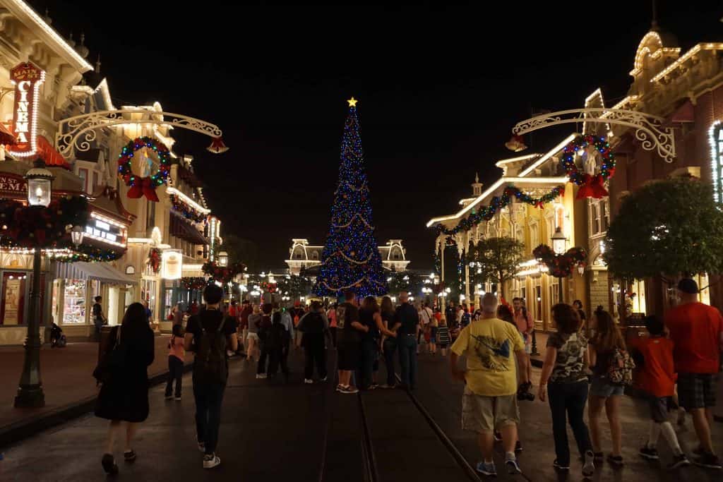 disney world-people walking on main street after dark-christmas