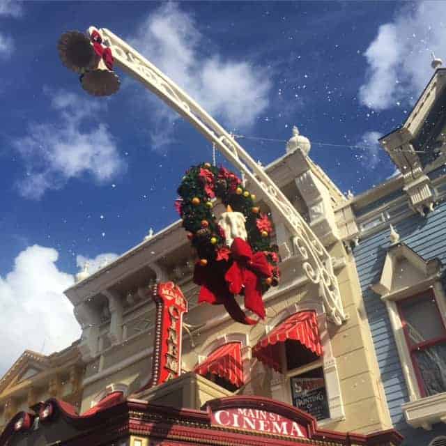 snow around building with wreath-main street usa-disney world at christmas