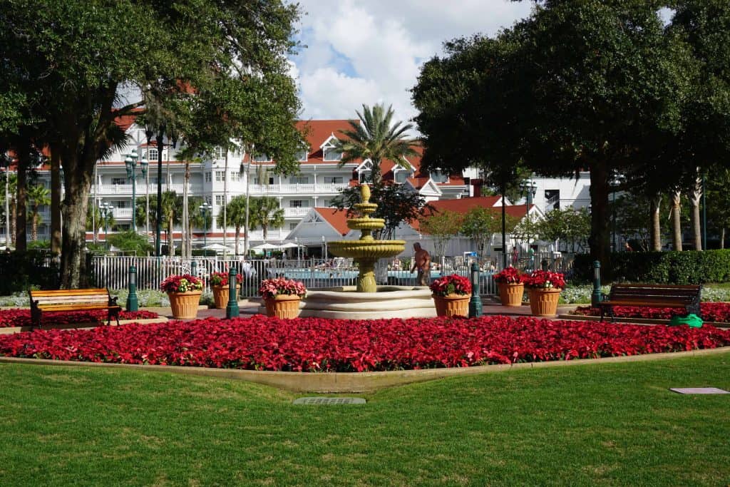 Red poinsettias around resort fountain at the Grand Floridian Resort at Disney World in Orlando, Florida. 