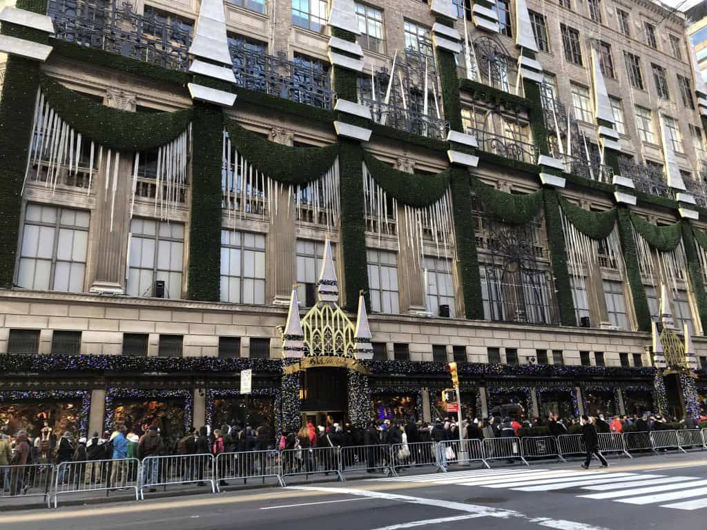 line at saks fifth avenue holiday windows-new york city at christmas
