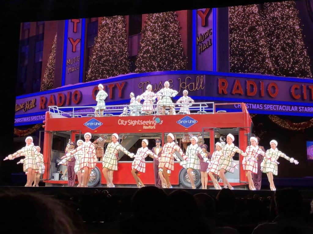 radio city rockettes with city sightseeing bus-new york city at christmas