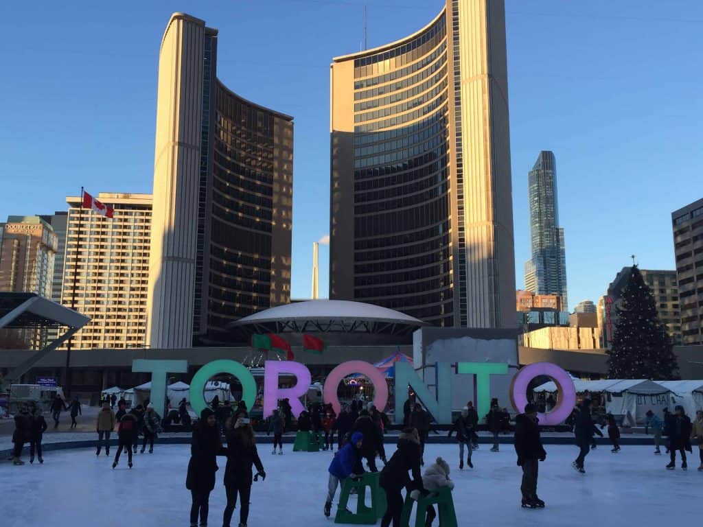 skating in front of Toronto sign nathan philips square