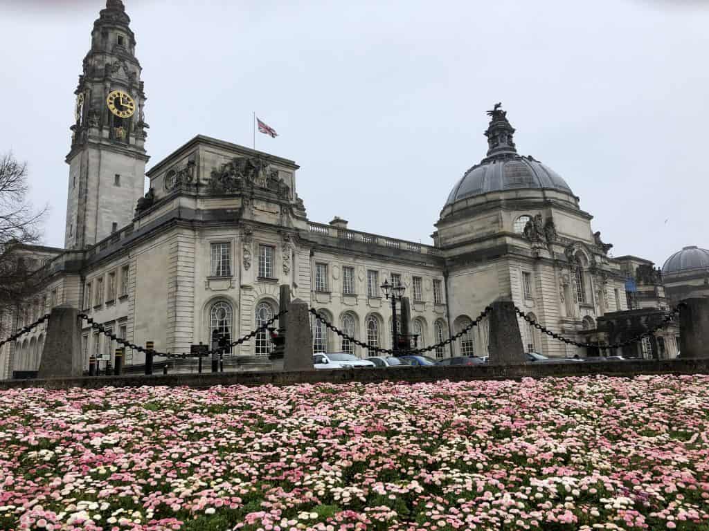 pink and white flowers in front of National Museum Cardiff