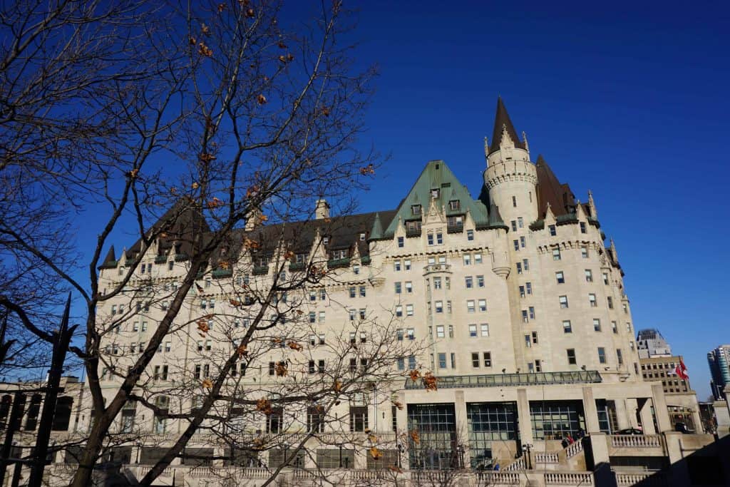 Exterior of chateau laurier in ottawa, canada in winter with bright blue sky.