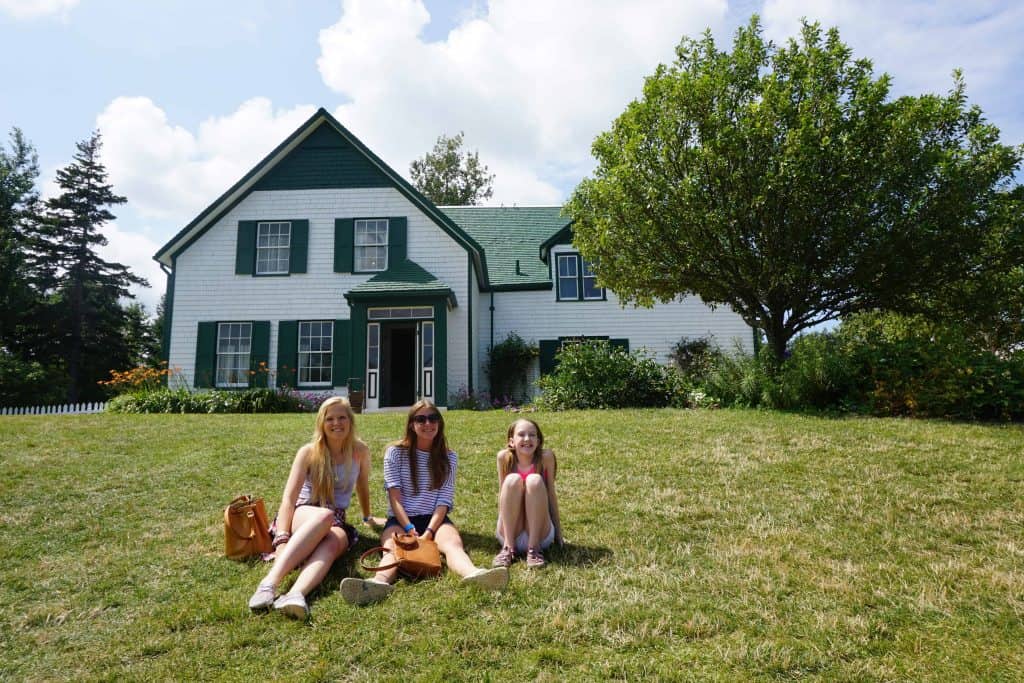 Three girls outside the Green Gables home in Cavendish, Prince Edward Island.