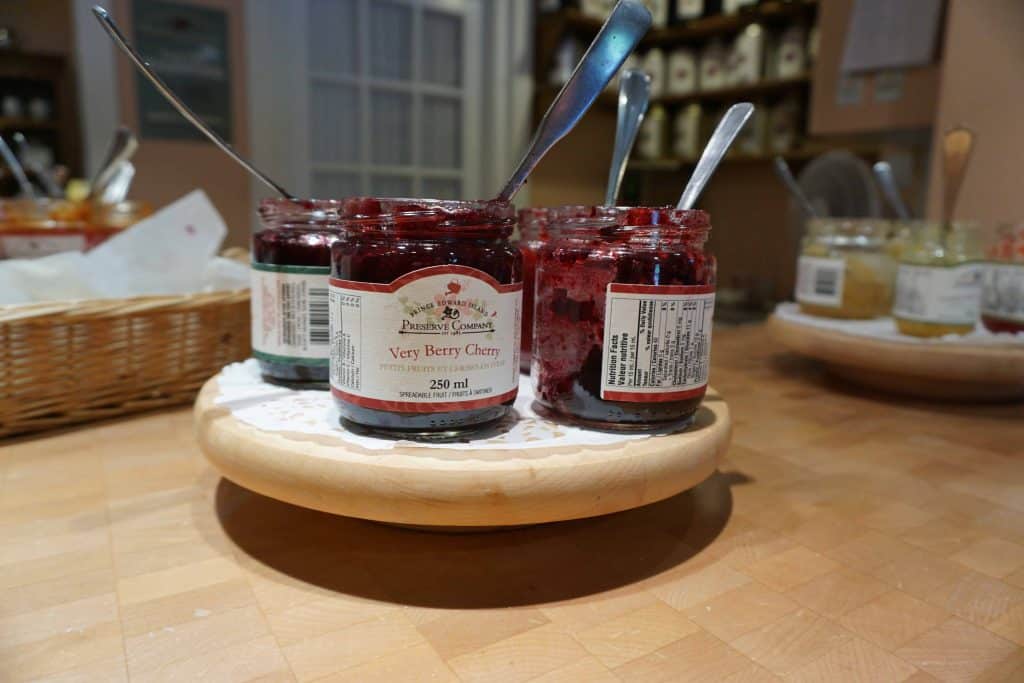 spoons in jars of preserved fruit at PEI Preserve Company.