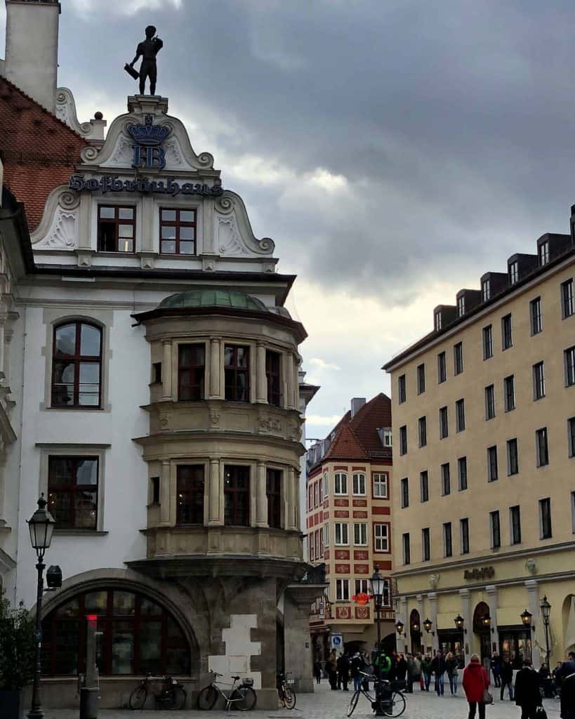 People walking in the street around the Hofbrauhaus building in Munich, Germany.