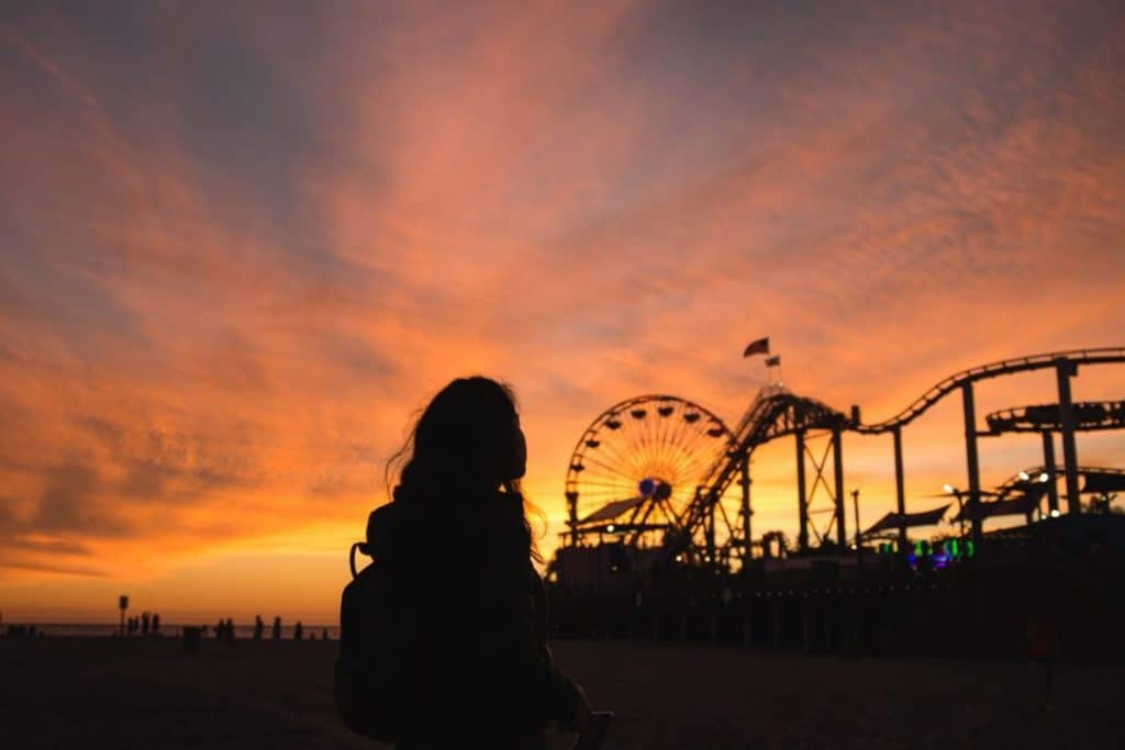california-woman at santa monica pier-sunset