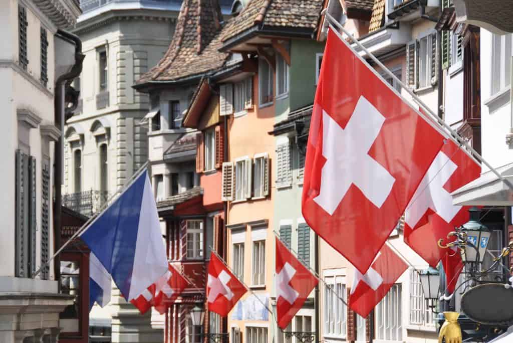 zurich-switzerland-street with swiss flags