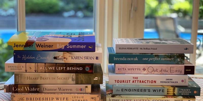 two stacks of books in window