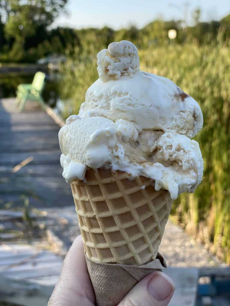 holding an ice cream cone in kagawong on manitoulin island