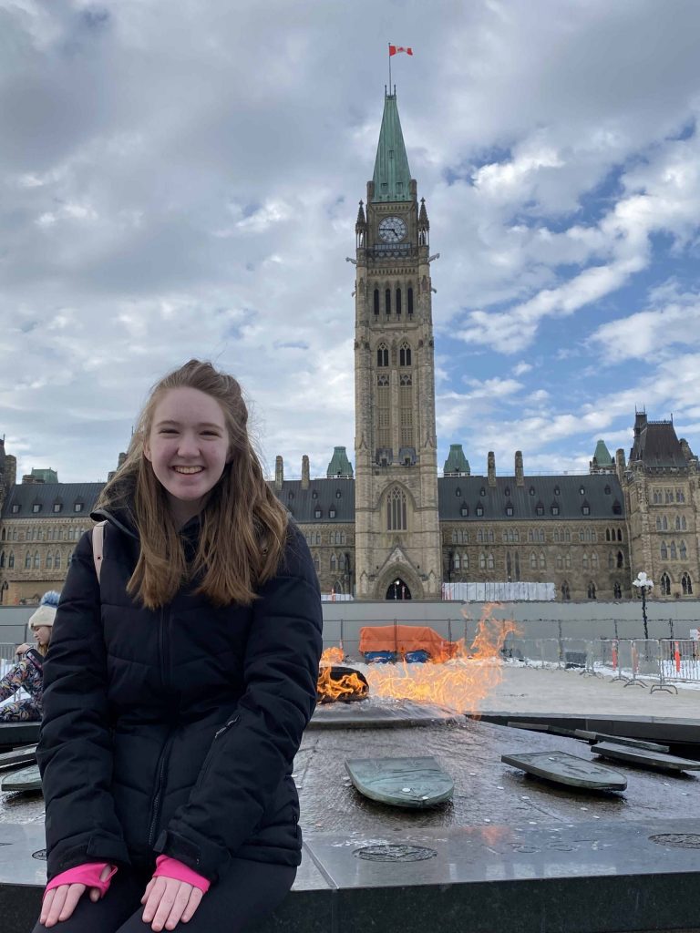 ottawa-parliament hill-young woman at centennial flame