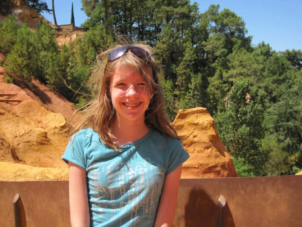 Young girl in quarry in Roussillon, France. 