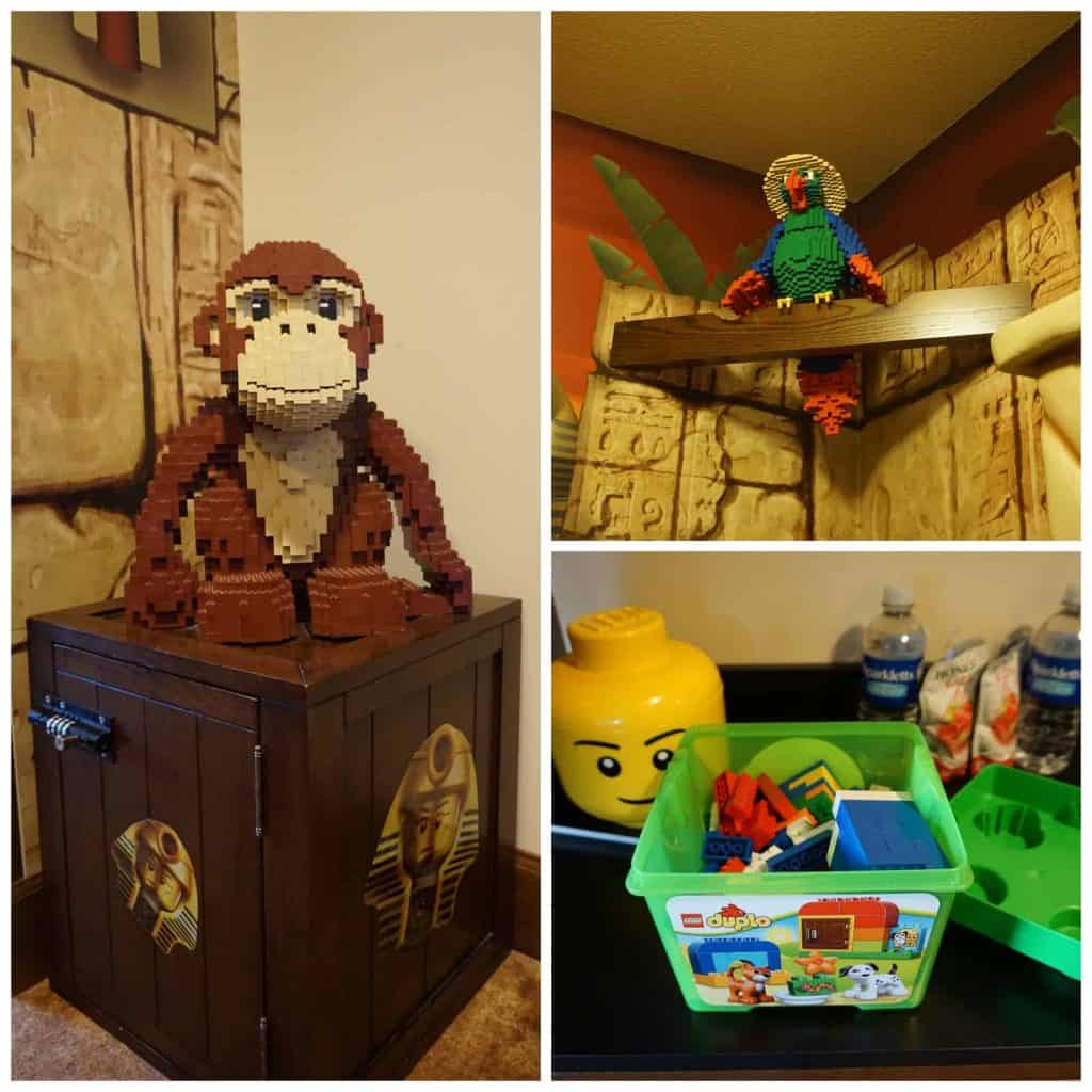 LEGO sculptures of monkey and parrot, plastic bin of LEGO bricks in hotel room at LEGOLAND Resort.