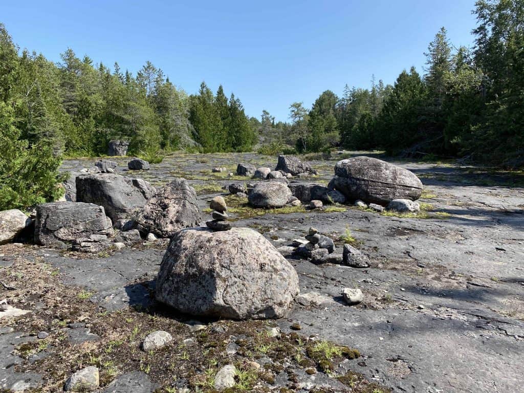 large rocks in forest in misery bay provincial park on manitoulin island.