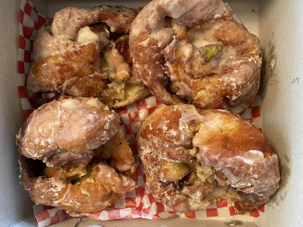 apple fritters in box from mum's bakery in Mindemoya on manitoulin island.