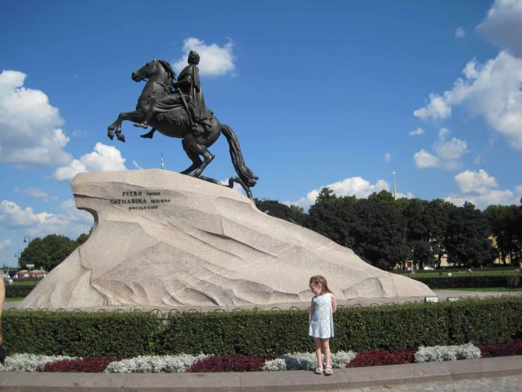 St. petersburg russia small girl at bronze horseman statue.