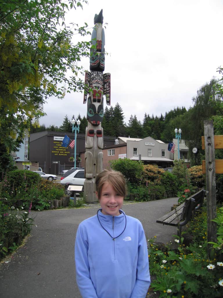 young girl with totem pole-ketchikan-alaska