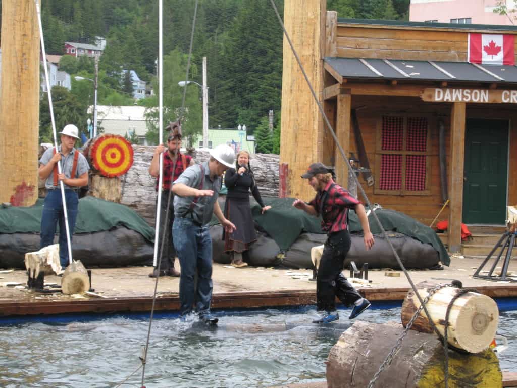 two lumberjacks rolling logs in water-great alaskan lumberjack show-ketchikan