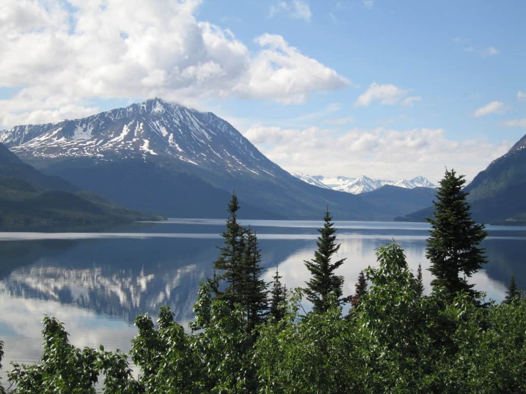 Lake and mountains with reflection in water on an excursion from Skagway, Alaska.