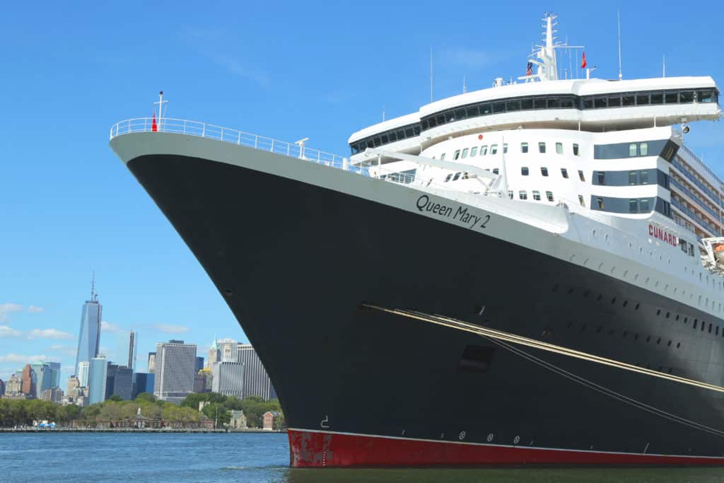 Queen Mary 2 shipped docked in Brooklyn with Manhattan skyline in background