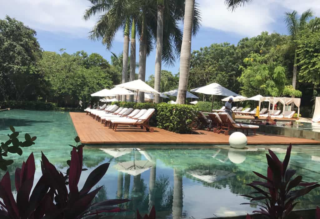 Deck chairs and pool at Grand Velas in Riviera Maya.