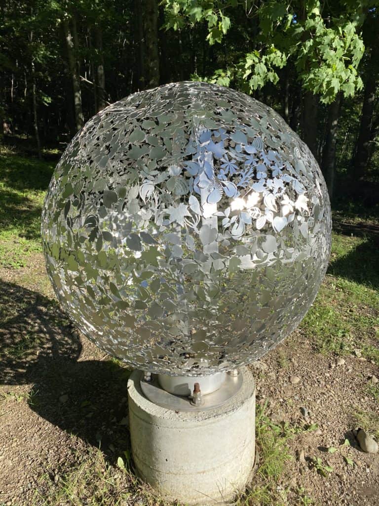 Silver globe sculpture on Billings Connection Trail, Kagawong, Ontario.