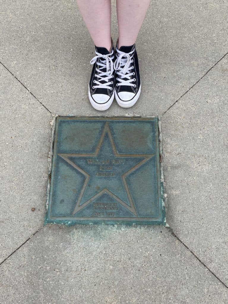 Bronze star of William Hutt on sidewalk in Stratford, Ontario.