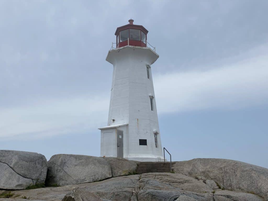 Red and white lighthouse in Peggy's Cove, Nova Scotia.