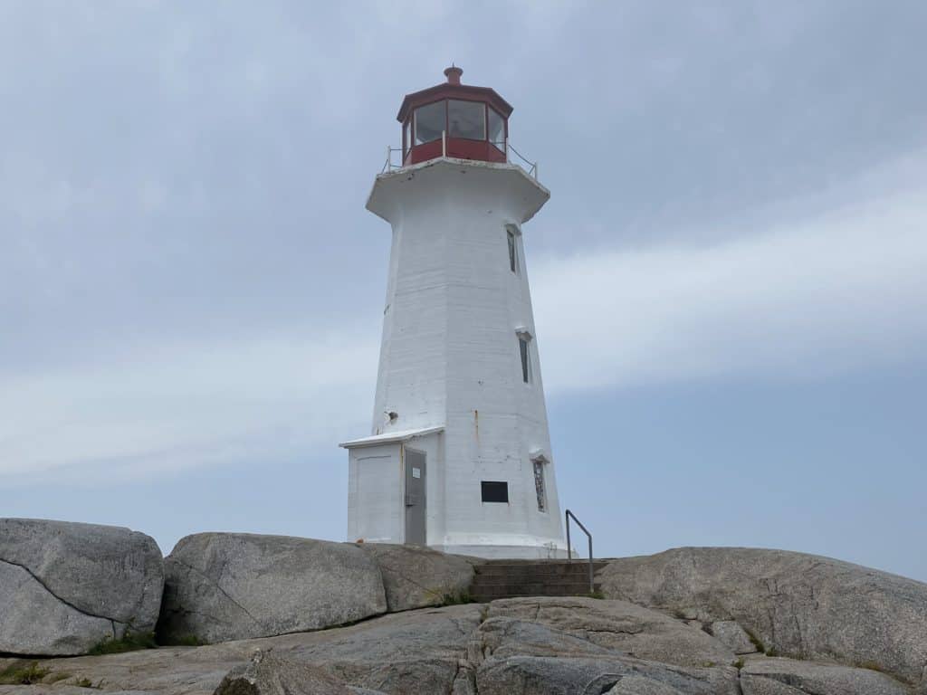 Red and white lighthouse in Peggy's Cove, Nova Scotia.
