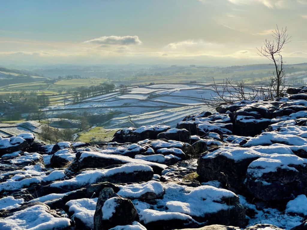 Yorkshire dales in winter with snow on the ground.