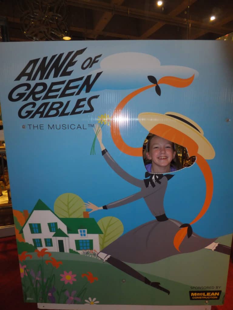 Young girl's face in cutout for Anne of Green Gables: The Musical at the Confederation Centre in Charlottetown, Prince Edward Island.