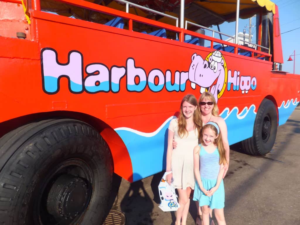 Woman and two girls beside the Harbour Hippo in Charlottetown, Prince Edward Island.