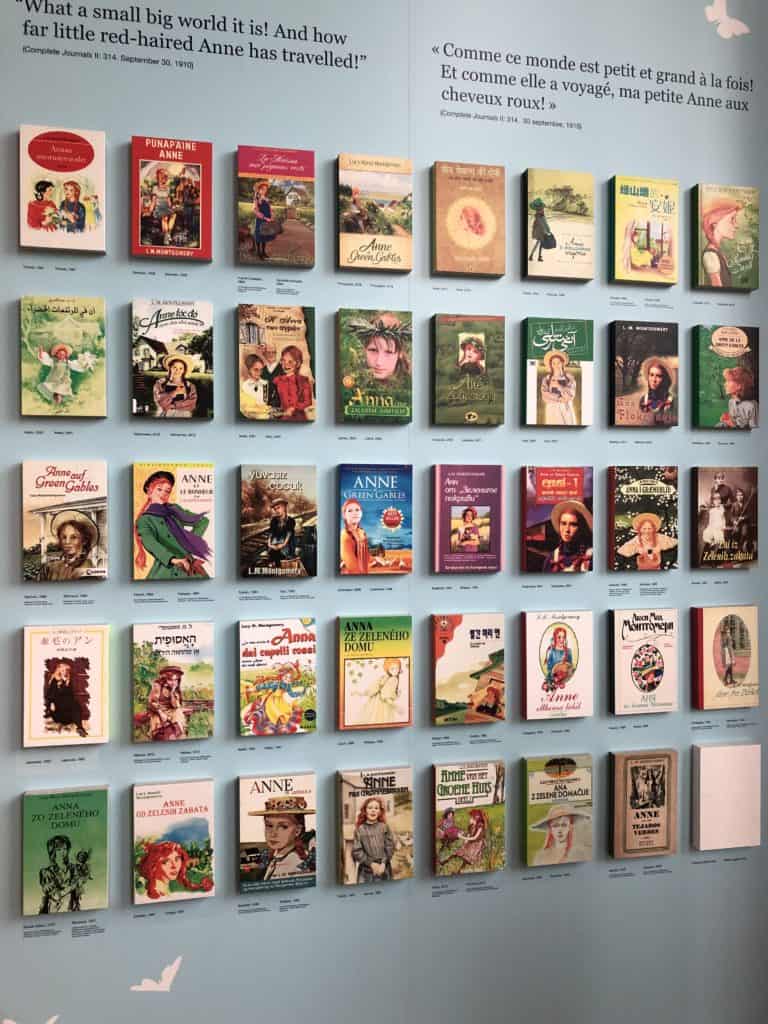 Wall display of covers of international versions of Anne of Green Gables at Green Gables Visitor Centre in Cavendish, PEI>
