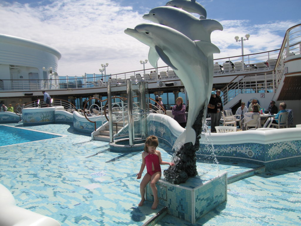 Young girl enjoying the pool on Diamond Princess cruise to Alaska.