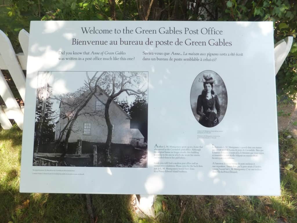 Exhibit board displayed outside Green Gables post office welcoming visitors and explaining Anne of Green Gables connection.
