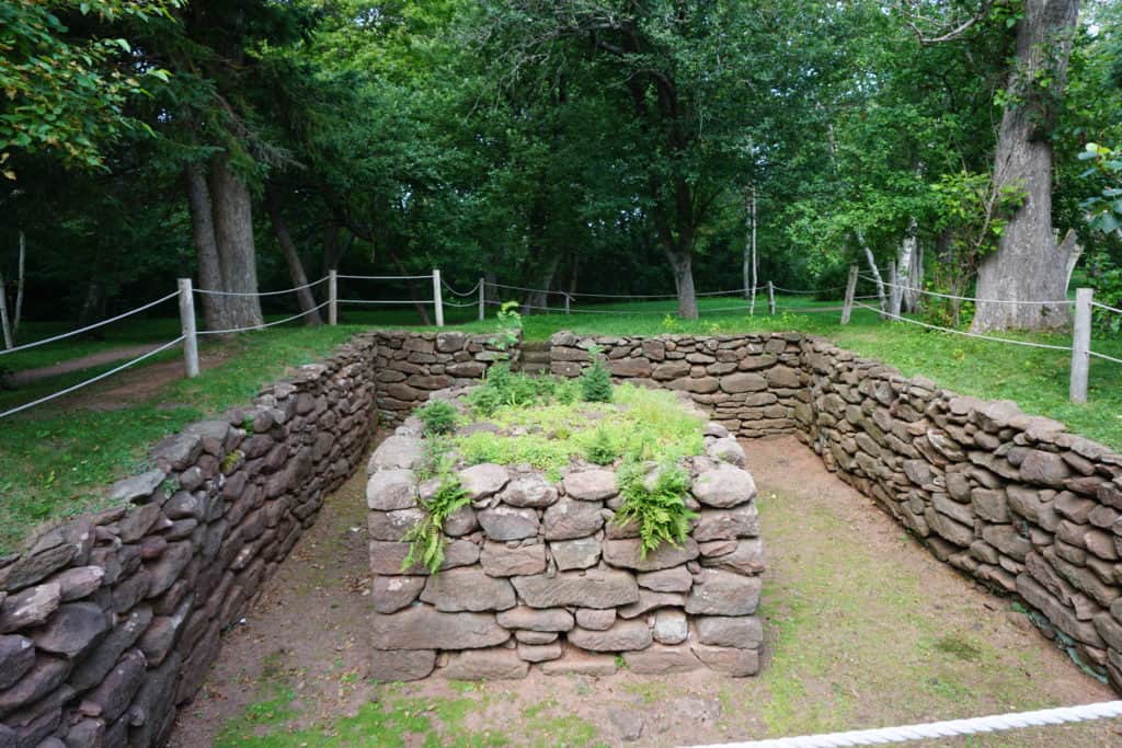 Fenced-in stone foundation of what remains of Lucy Maud Montgomery's Cavendish home.