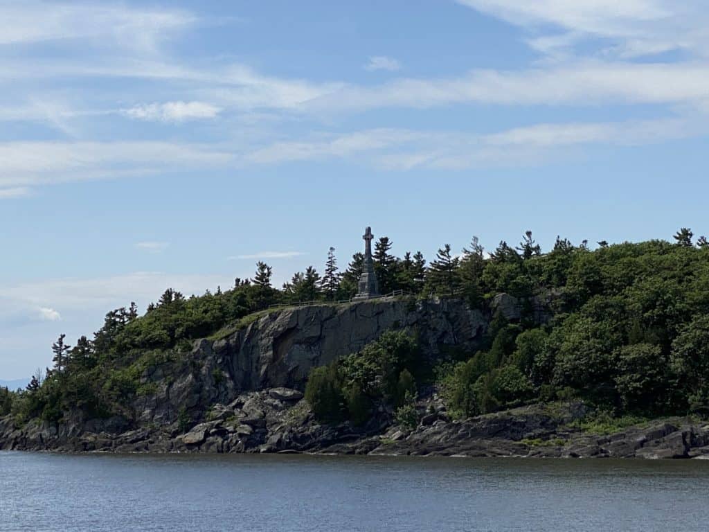 Celtic cross on rocky cliff of Grosse-Île, Québec.