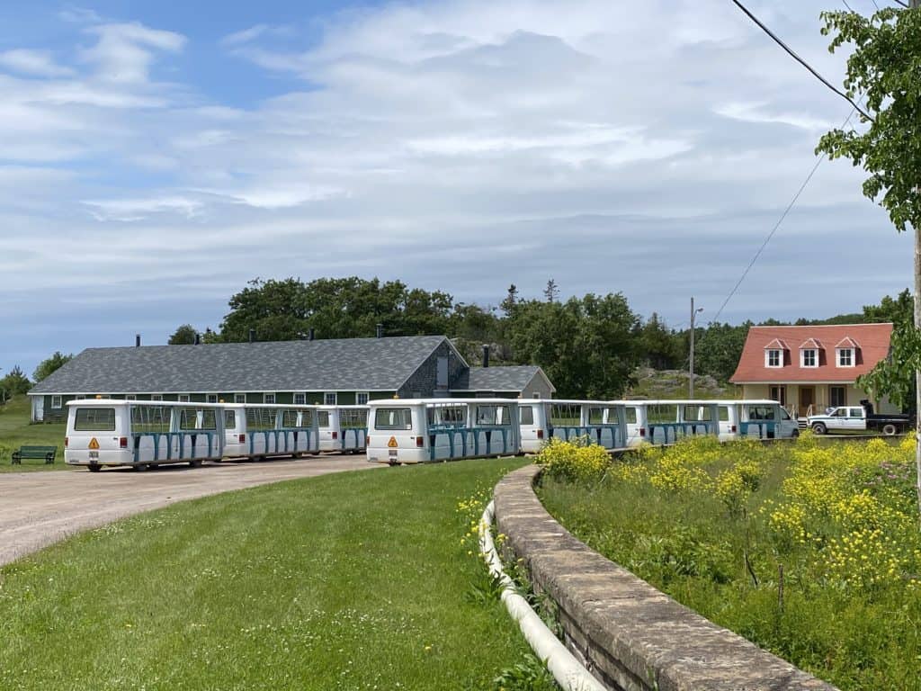 trolley cars parked on roadway, Grosse-Île, Québec