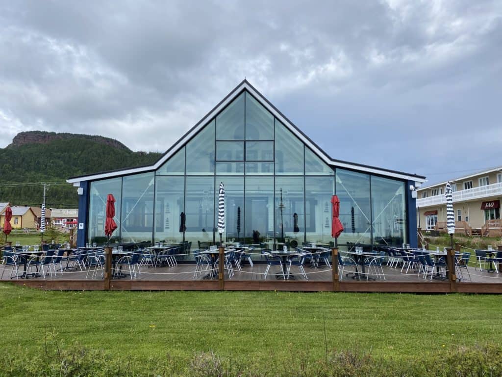 Exterior of La Maison de Pecheur restaurant with outdoor patio.