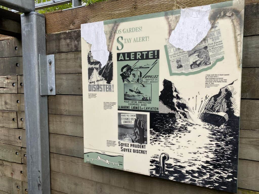 Stay Alert sign entering World War II underground fortifications at Fort Peninsula in Forillon National Park, Quebec.