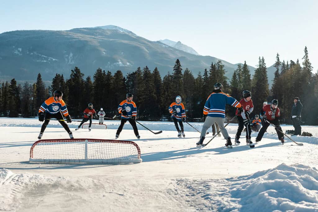 hockey players on frozen pond in Jasper