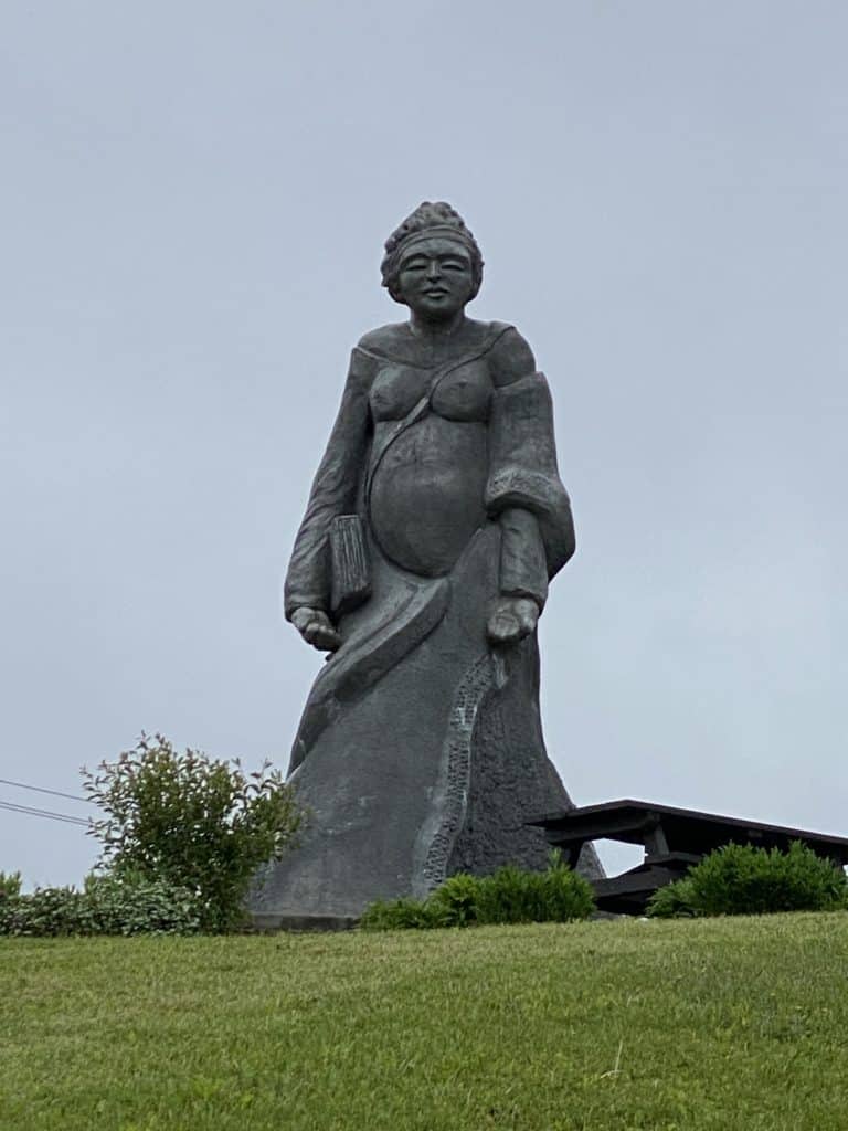 large sculpture of woman titled In Memory of Her in Gaspe, Quebec