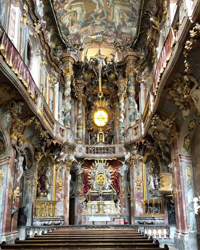 Opulent interior of Asamkirche (Asam's Church) facing altar at front, Munich, Germany.