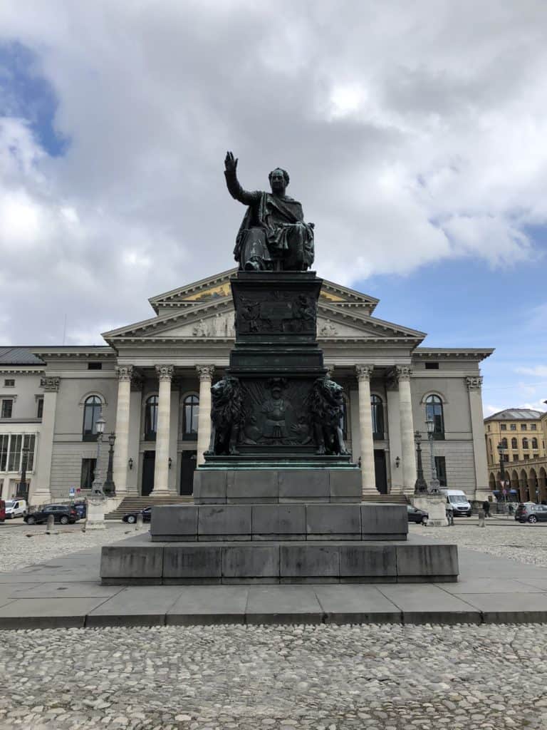 Statue in front of building with columns in Max-Joseph Platz, Munich, Germany.