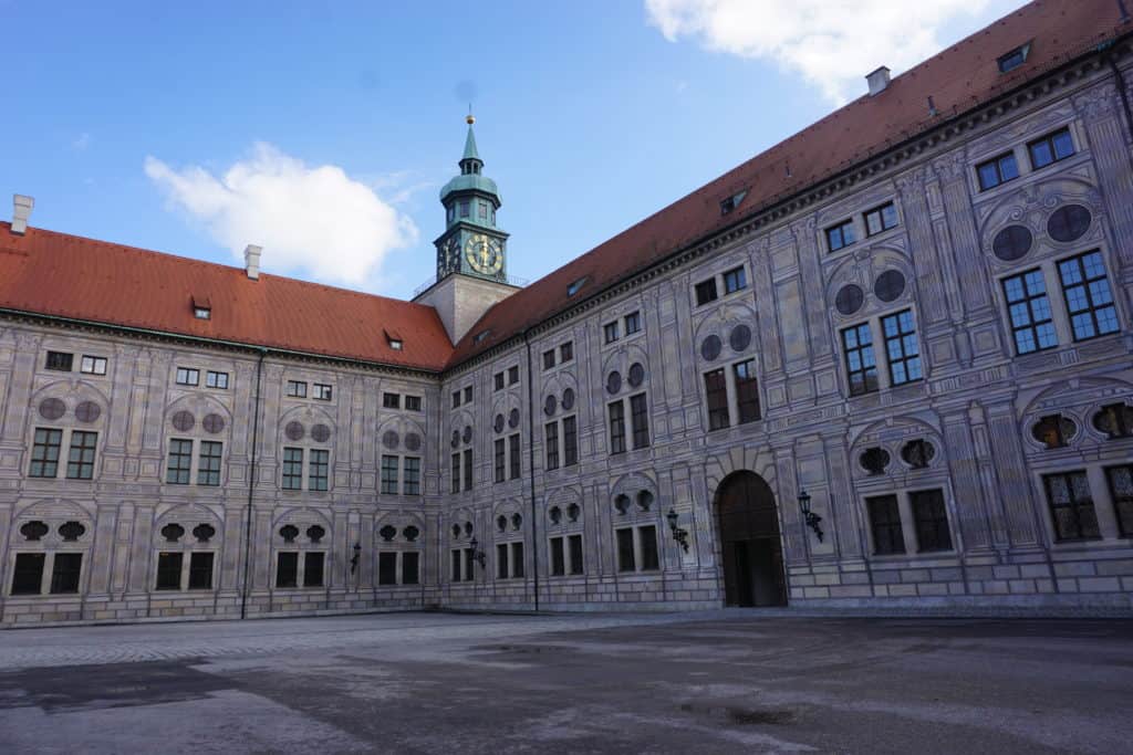 Exterior of Munich Residenz building with blue sky and clouds, Munich, Germany.