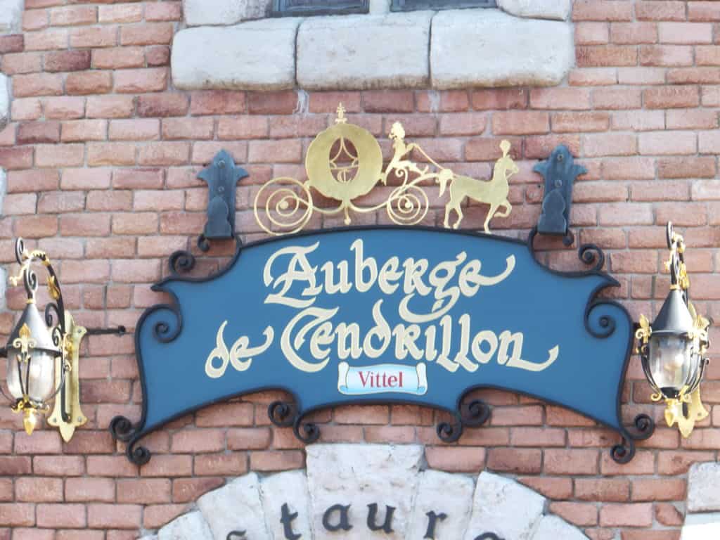 Sign reading Auberge de Cendrillon (Cinderella's Inn) at Disneyland Paris.