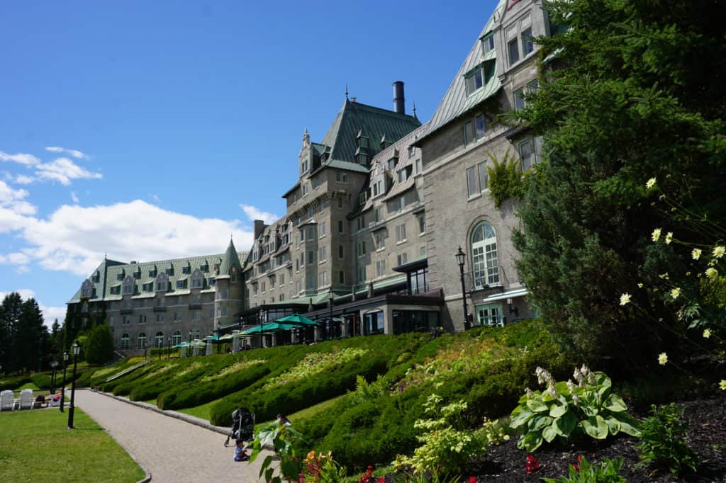 Exterior of Fairmont Le Manoir Richelieu in La Malbaie, Quebec on a summer day.