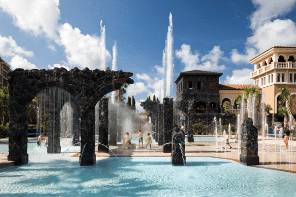 Splash pad with children playing at Four Seasons Resort Orlando at Disney World.