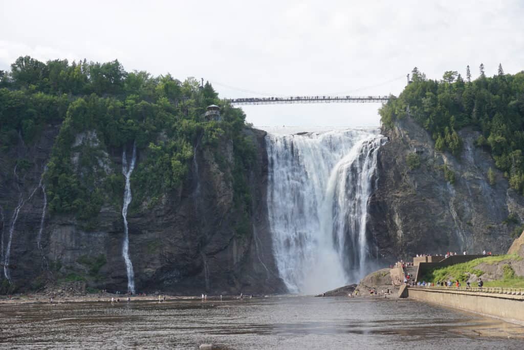 View of Montmorency Falls and suspension bridge from a distance.